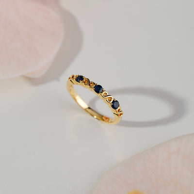 253R7010-03_925 Yellow Gold Plated Sterling Silver Round Blue Sapphire Infinity Stackable Ring_Flat Lay_1