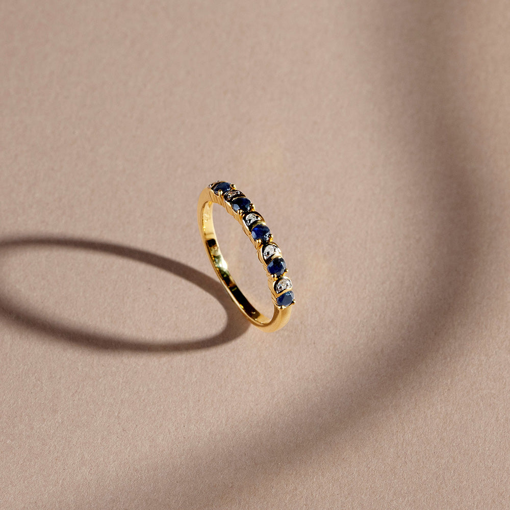 253R7011_03_925 Yellow Gold Plated Sterling Silver Round Blue Sapphire Criss Cross X Ring_Flat lay_1